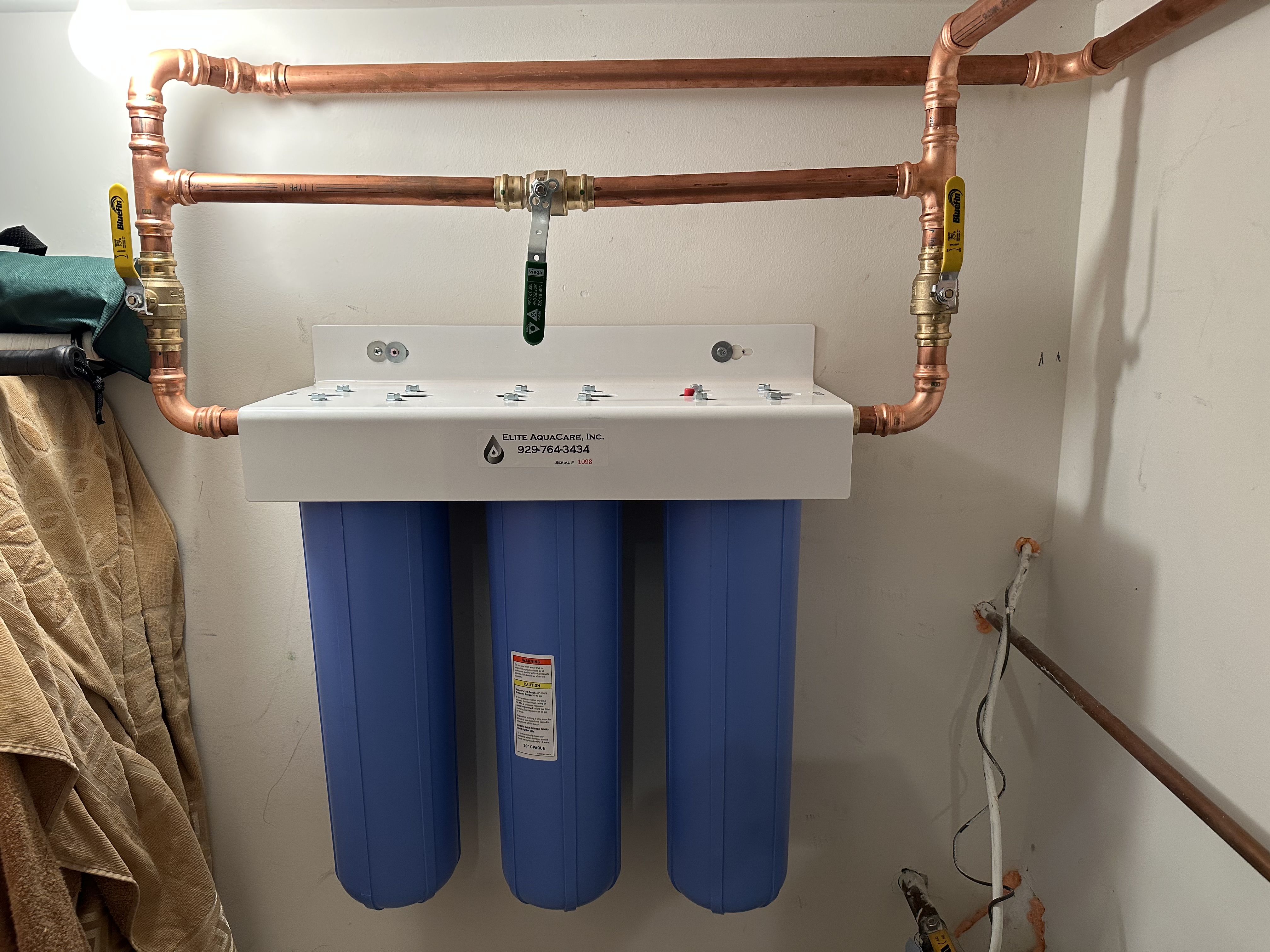 Vadim installing a residential water filtration system